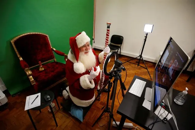Severino Moreira does a Santa Claus video call during the COVID-19 pandemic in Lisbon, Portugal, December 11, 2020. (Photo by Pedro Nunes/Reuters)