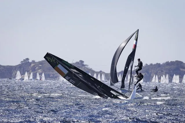 Seafra Guilfoyle with Johnny Durcan capsize while competing in extreme wind condition during French Olympic Week in Hyerés, France on April 25, 2023. (Photo by David Branigan/Inpho via Oceansport)