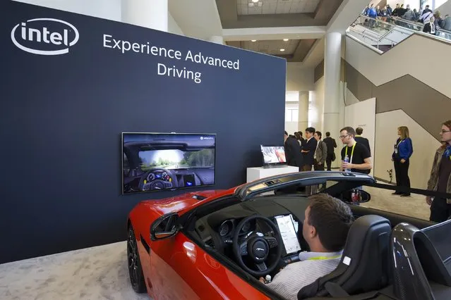 Rodney Stewart demonstrates electronic safety features built into a Jaguar convertible at the Intel booth during the 2015 International Consumer Electronics Show (CES) in Las Vegas, Nevada January 6, 2015. (Photo by Steve Marcus/Reuters)