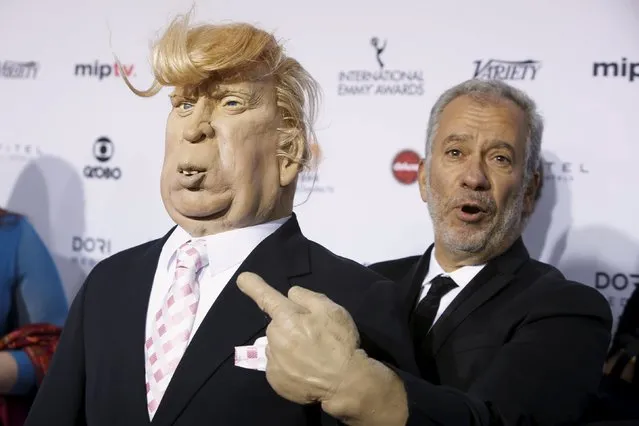 South Africa-based television producer Thierry Cassuto (R) holds a puppet of U.S businessman and Republican Presidential candidate Donald Trump as he attends the International Emmy Awards in Manhattan, New York November 23, 2015. (Photo by Andrew Kelly/Reuters)