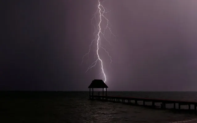 Lightning strikes the Caribbean as a thunderstorm passes Tankah Bay, near Tulum, southern Mexico, August 31, 2017. (Photo by Andrew Winning/Reuters)