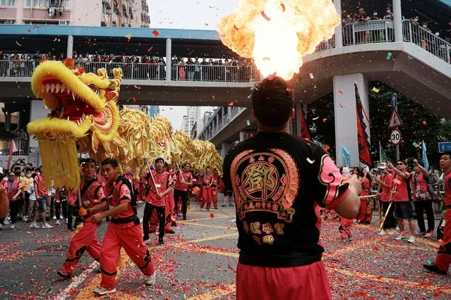 Participants preform dragon dance and fire breathing during a parade celebrating Tin Hau festival at Yuen Long district, in Hong Kong, China on May 12, 2023. (Photo by Lam Yik/Reuters)