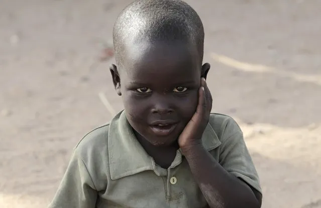 A boy displaced as a result of Boko Haram attack in the northeast region of Nigeria, poses for a picture at Maikohi secondary school camp for internally displaced persons (IDP) in Yola, Adamawa State January 13, 2015. (Photo by Afolabi Sotunde/Reuters)