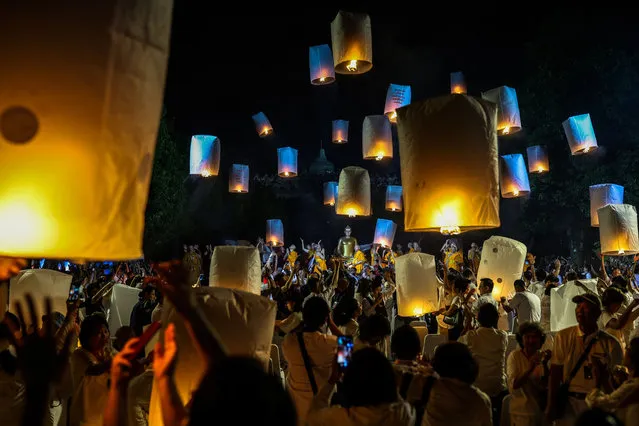Buddhist devotees release lanterns at the Borobudur temple as a part of celebrations for Vesak Day on June 4, 2023, in Magelang, Indonesia. (Photo by Garry Lotulung/NurPhoto via Getty Images)