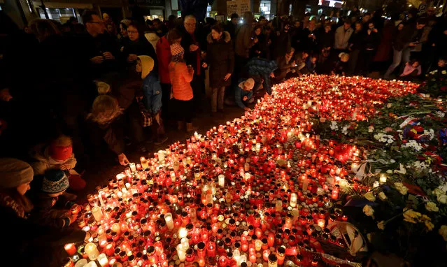 People light candles at the Velvet Revolution memorial at Narodni street to commemorate the 27th anniversary 1989 Velvet Revolution in Prague, Czech Republic, November 17, 2016. (Photo by David W. Cerny/Reuters)