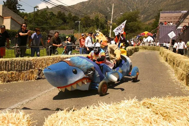 Competitors ride a home-made vehicle without an engine on a downhill track in the Red Bull Soapbox Race in Santiago, Chile, November 27, 2016. (Photo by Jonathan Faus/Reuters)