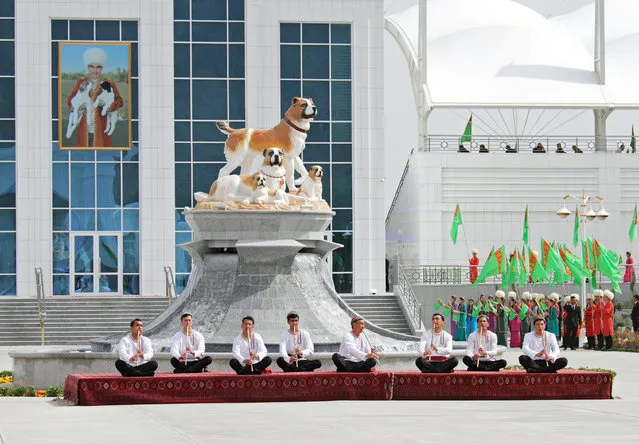 Musicians perform during celebrations for the national Turkmen Horse Day and the Turkmen Shepherd Dog Day near Ashgabat, Turkmenistan on April 25, 2021. (Photo by Vyacheslav Sarkisyan/Reuters)