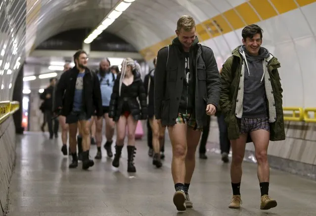 Passengers not wearing pants walk through a subway train transfer tunnel during the "No Pants Subway Ride" in Prague, Czech Republic, January 10, 2016. The event is an annual flash mob and occurs in different cities around the world in January, according to its organisers. (Photo by David W. Cerny/Reuters)