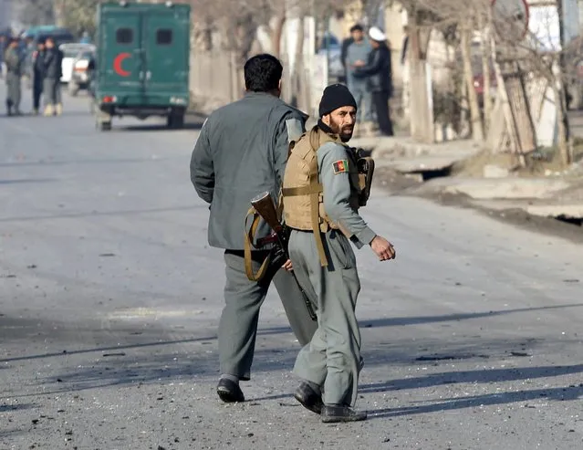 Afghan police arrive after a blast near the Pakistani consulate in Jalalabad, Afghanistan January 13, 2016. (Photo by Reuters/Parwiz)
