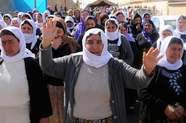 Kurdish Yazidis, relatives of a Peshmerga fighter killed in a suicide attack in Sinjar province, mourn after the body is taken for burial at an area where displaced Yazidis live, at the outskirts of Duhok,  March 2, 2015. A number of Peshmerga were killed and others injured after two suicide car bombs attacks targeted a building the Peshmerga were using for fighting, according to Peshmerga officials. REUTERS/Asmaa Waguih 