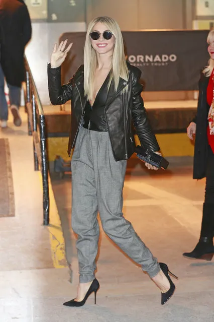 Julianne Hough wears a leather jacket and plunging leather top in freezing temperatures in New York. New York City, NY on Wednesday, December 14, 2016. (Photo by PacificCoastNews)