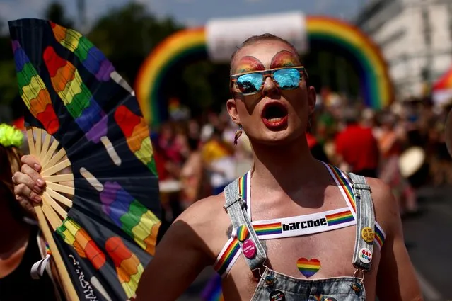 Reveller takes part in the annual Rainbow Parade, a pride parade to support the rights of lesbian, gay, bisexual, transgender, intersеx and queer (LGBTIQ) people in Vienna, Austria on June 19, 2021. (Photo by Lisi Niesner/Reuters)