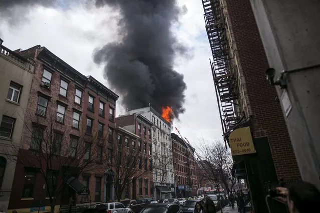 Flames rise from a building fire in the East Village neighborhood of New York City on March 26, 2015. (Photo by Ben Hider/Reuters)