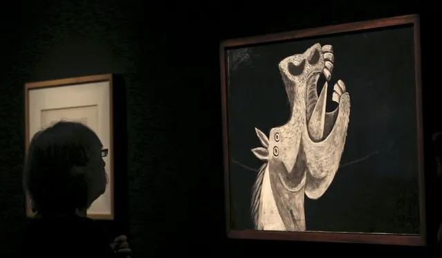 A person views the painting “Horse Head, sketch for Guernica” from 1937 by Spanish artist Pablo Picasso at the exhibition “Picasso and the Spanish Modernity” at Centro Cultural Banco do Brazil in Sao Paulo March 25, 2015. (Photo by Paulo Whitaker/Reuters)