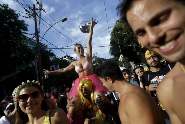 Revellers take part in an annual block party known as “Ceu na Terra” (Heaven on Earth), one of the many carnival parties to take place in the neighbourhoods of Rio de Janeiro, Brazil, February 6, 2016. (Photo by Ricardo Moraes/Reuters)