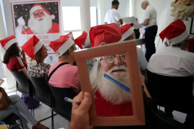 Students of Santa Claus school attend their classes in Sao Paulo, Brazil on December 4, 2018. (Photo by Paulo Whitaker/Reuters)