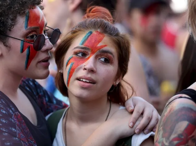 Revellers parade during the annual block party known as “To de Bowie” (Meanwhile, I'm with David Bowie), in downtown Sao Paulo, Brazil February 9, 2016. (Photo by Paulo Whitaker/Reuters)