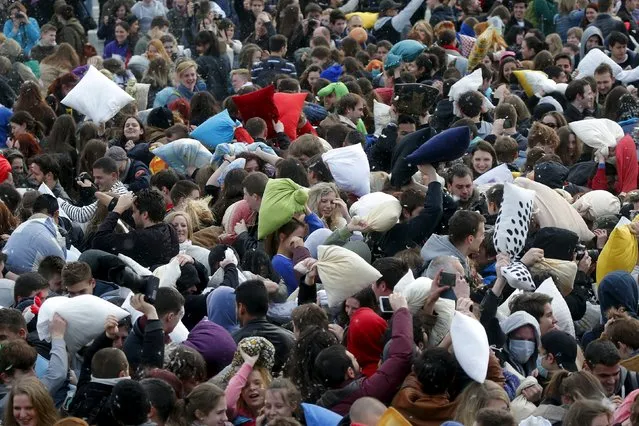 People fight with pillows during International Pillow Fight Day at Heroes Square in Budapest  April 4, 2015. (Photo by Laszlo Balogh/Reuters)