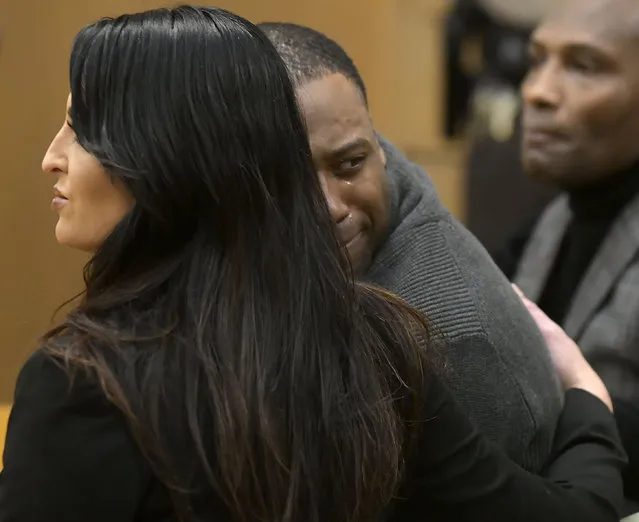 Torrey Green looks back at his family while being consoled by defense attorney Skye Lazaro, after a jury finds him guilty of eight charges including five counts of rape and a charge sexual battery in connection to reports from six women accusing him of sexual assault while he was a football player at Utah State University, Friday, January 18, 2019 in Brigham City, Utah. (Photo by Eli Lucero/Herald Journal via AP Photo)