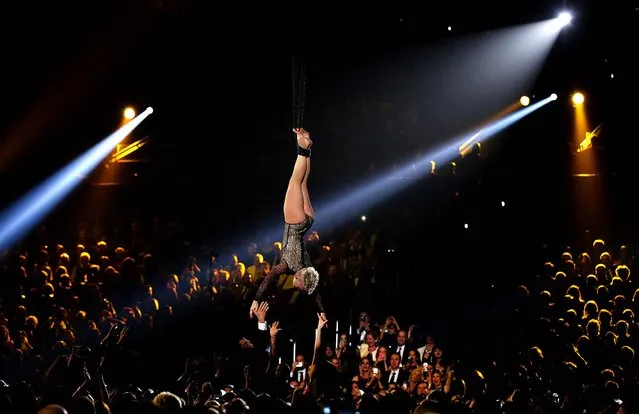 Pink twirls in the air in her signature Cirque du Soleil-form. (Photo by Matt Sayles/Invision)