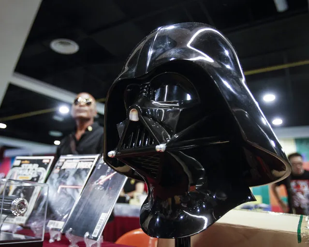 A life-sized Darth Vader helmet is seen on display at a Star Wars Day gathering in a mall downtown Kuala Lumpur, Malaysia, Saturday, May 2, 2015. (Photo by Joshua Paul/AP Photo)
