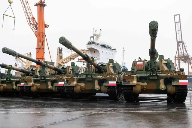 Army equipment is seen in the port after the arrival of the first K2 tanks and K9 howitzers for Poland on December 6, 2022 at the Baltic Container Terminal in Gdynia. The Polish Army is strengthening its potential with the use of South Korean defense technologies. In July 2022 an agreement was concluded with Hyundai Rotem for the acquisition of a total of 1,000 K2 tanks with accompanying vehicles. Poland has massively stepped up weapons purchases since Russia invaded Ukraine, as well as sending military aid to Kyiv and taking in millions of Ukrainian refugees. (Photo by Mateusz Slodkowski/AFP Photo)