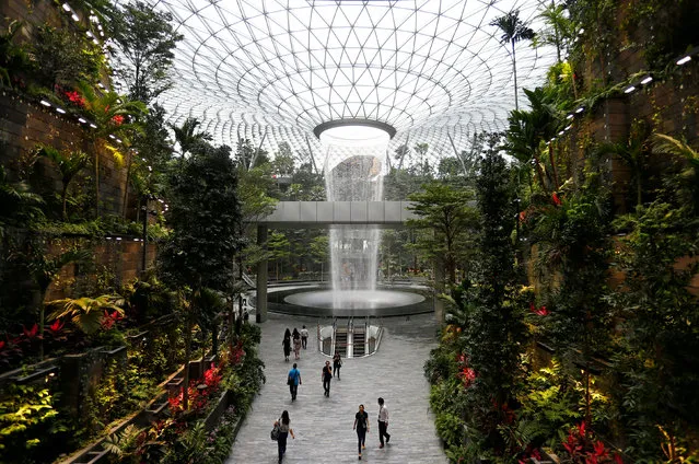 The 40-metre high Rain Vortex, which is the world's tallest indoor waterfall, is seen from inside Jewel Changi Airport in Singapore, April 11, 2019. (Photo by Feline Lim/Reuters)