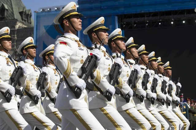 Chinese army soldiers march along the Red Square during a general rehearsal for the Victory Day military parade which will take place at Moscow's Red Square on May 9 to celebrate 70 years after the victory in WWII, in Moscow, Russia, Thursday, May 7, 2015. (Photo by Alexander Zemlianichenko/AP Photo)