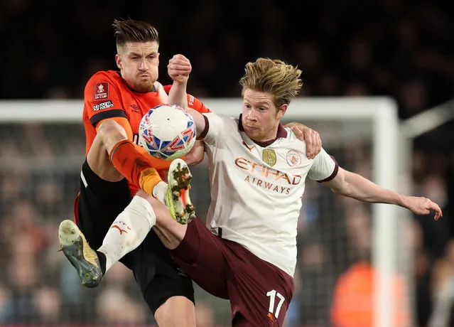 Reece Burke of Luton Town and Kevin De Bruyne of Manchester City during the Emirates FA Cup Fifth Round match between Luton Town and Manchester City at Kenilworth Road on February 27, 2024 in Luton, England. (Photo by David Klein/Reuters)