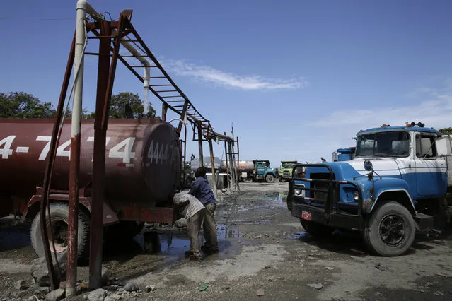 Haitians fill trucks with water in Port-au-Prince, Haiti, March 8, 2016. March 22 marks World Water Day. (Photo by Andres Martinez Casares/Reuters)