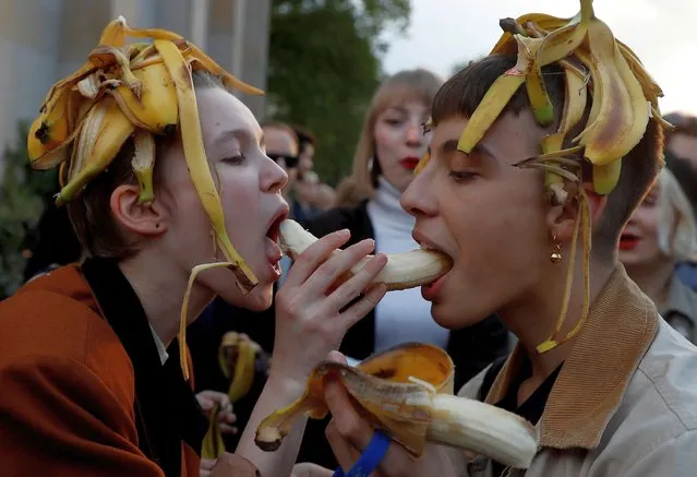 People eat bananas during a protest against perceived censorship by Poland's National Museum in front of the National Museum in Warsaw, Poland on April 29, 2019. (Photo by Kacper Pempel/Reuters)