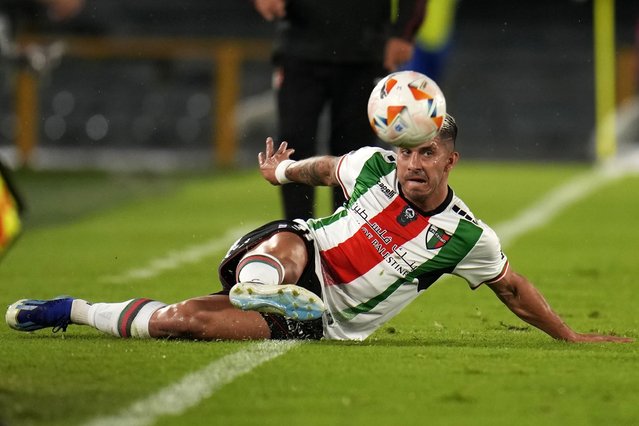 Jonathan Benitez of Chile's Palestino keeps the ball in play during a Copa Libertadores Group E soccer match against Colombia's Millonarios at El Campin stadium in Bogota, Colombia, May 14, 2024. (Photo by Fernando Vergara/AP Photo)