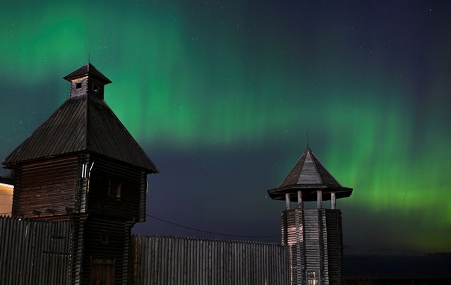 The aurora borealis, also known as the 'northern lights’, caused by a coronal mass ejection on the Sun, illuminate the skies over the southwestern Siberian town of Tara, Omsk region, Russia on May 11, 2024. (Photo by Alexey Malgavko/Reuters)