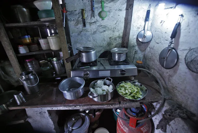 A kitchen is pictured in a house at a slum in New Delhi July 29, 2013. (Photo by Anindito Mukherjee/Reuters)