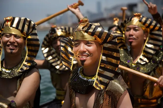 Dragon boat racers prepare for the fancy dress race on July 5, 2015 in Hong Kong, Hong Kong. The Hong Kong Dragon Boat Carnival will be staged from 3 July 2015 (Friday) to 5 July 2015 (Sunday). The carnival featured two key programmes: the CCB (Asia) Hong Kong International Dragon Boat Races in Victoria Harbour and the San Miguel BeerFest at the UC Centenary Garden in East Tsim Sha Tsui. (Photo by Taylor Weidman/Getty Images for Hong Kong Images)