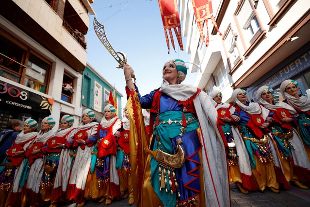A “Comparsa of Muslims” takes part in the “Moorish entrance” parade during the Moors and Christians festival in Elda, in the south of the province of Alicante, Spain, on June 16, 2024. (Photo by Eva Manez/Reuters)