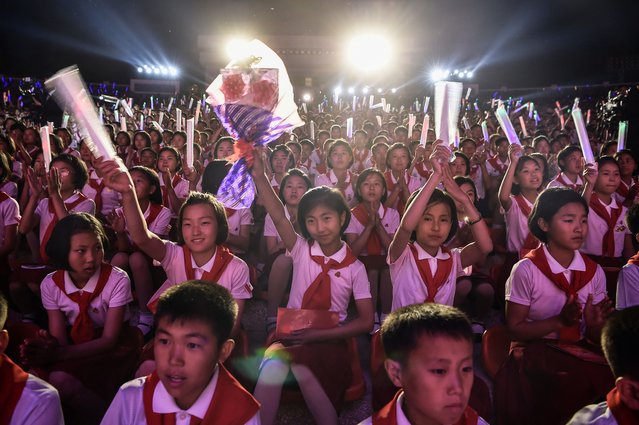 Schoolchildren take part during celebrations for the 78th anniversary of the Korean Children's Union (KCU) at the Pyongyang Municipal Youth Park Open-Air Theatre in Pyongyang on June 5, 2024. (Photo by Kim Won Jin/AFP Photo)