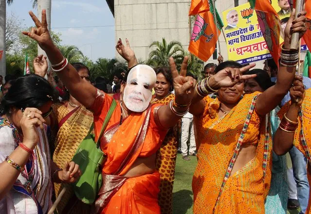 Bharatiya Janata Party supporters celebrate their party's victory in Bhopal, on May 16, 2014. (Photo by Sanjeev Gupta/EPA)