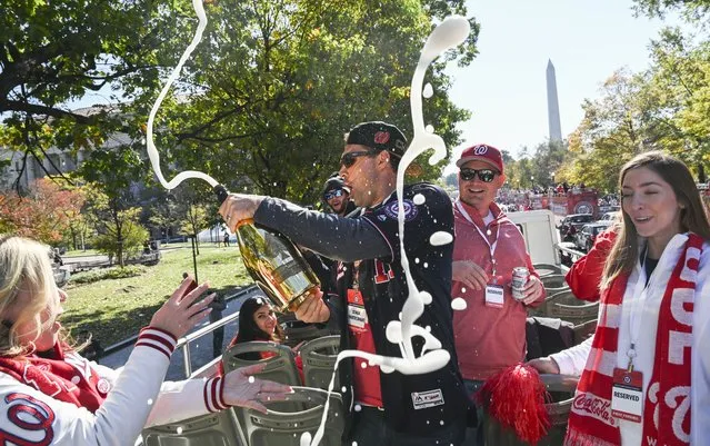 Nationals first baseman Ryan Zimmerman, center, pours champagne before the start of a parade to honor the team’s first World Series championship in Washington, D.C. on November 2, 2019. (Photo by Toni L. Sandys/The Washington Post)