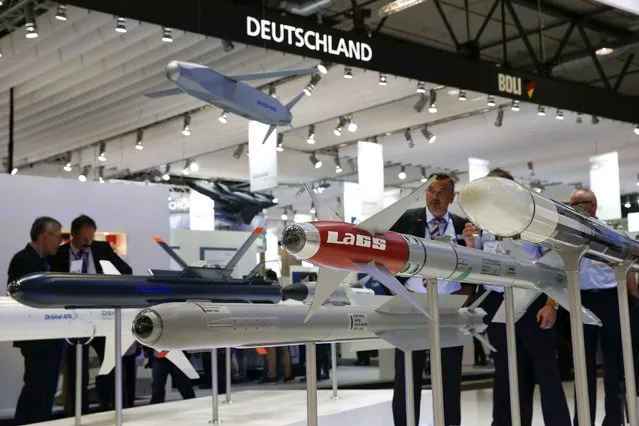 Visitors look at dummy missiles at the booth of Diel defence company during the ILA Berlin Air Show in Schoenefeld, south of Berlin, Germany, June 1, 2016. (Photo by Fabrizio Bensch/Reuters)