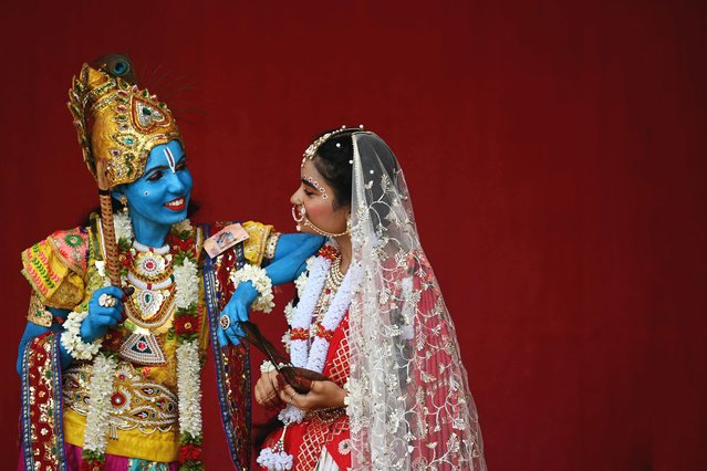 College students dress in the guise of Hindu deities Krishna and Radha, ahead of Janmashtami festival, in Chennai on August 23, 2024. (Photo by R.Satish Babu/AFP Photo)