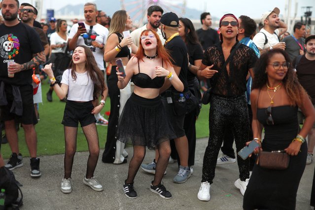 People enjoy the Rock in Rio music festival in Rio de Janeiro, Brazil on September 19, 2024. (Photo by Pilar Olivares/Reuters)