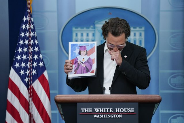 Actor Matthew McConaughey holds an image of Alithia Ramirez, 10, who was killed in the mass shooting at an elementary school in Uvalde, Texas, as he speaks during a press briefing at the White House, Tuesday, June 7, 2022, in Washington. (Photo by Evan Vucci/AP Photo)
