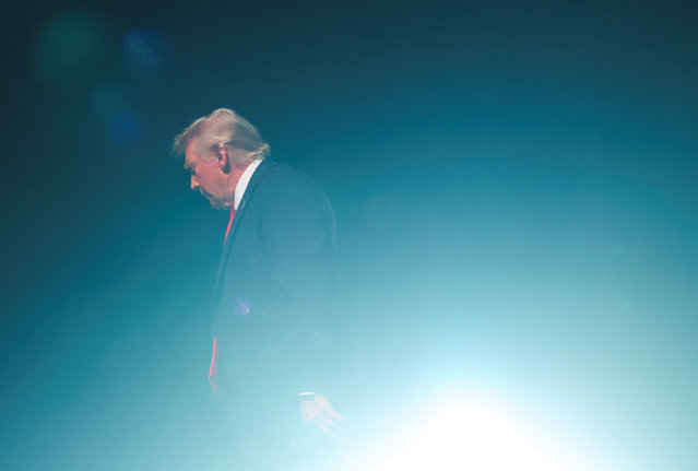 Republican presidential nominee and former U.S. President Donald Trump walks on the day of a fireside chat with Tucker Carlson at 'Tucker Carlson Live on Tour' at Desert Diamond Arena, in Glendale, Arizona, U.S. October 31, 2024. (Photo by Brendan McDermid/Reuters)