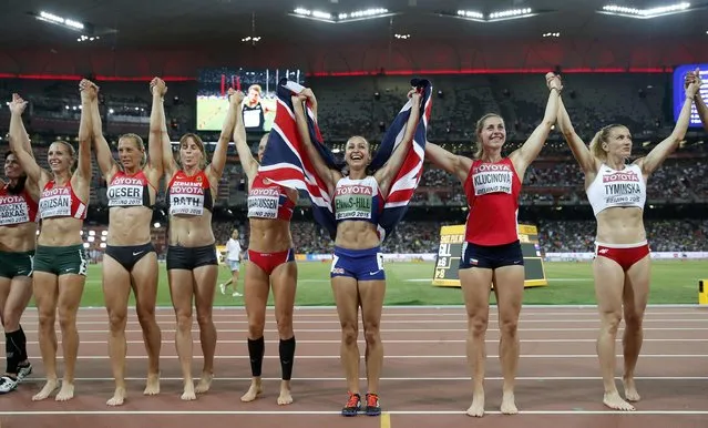 Winner Jessica Ennis-Hill of Britain (3rd R) celebrates with other athletes after competing in the women's heptathlon during the 15th IAAF World Championships at the National Stadium in Beijing, China, August 23, 2015. (Photo by Phil Noble/Reuters)