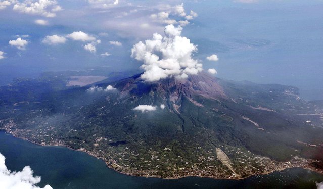 This aerial photo shows Sakurajima volcano in Kagoshima, southern island of Kyushu, Japan, one day after its eruption, Monday, July 25, 2022. The volcano spewed ash and large rocks into the nighttime sky on Sunday. (Photo by Kyodo News via AP Photo)