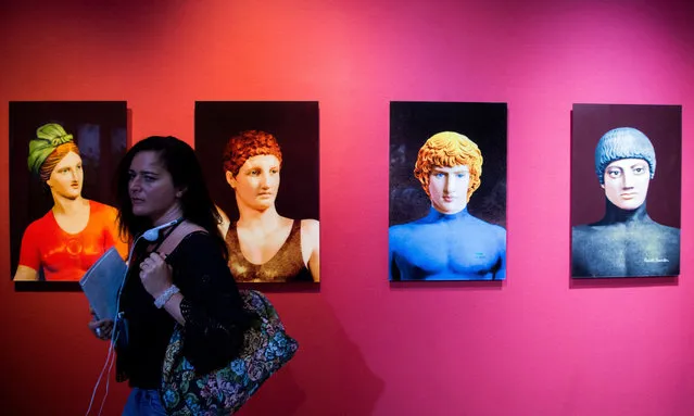 A visitor attends an exhibition entitled “New mythology” of Russian artist Olga Tobrelutz during a press preview at the Kunsthalle (Mucsarnok) in Budapest, Hungary, 05 September 2017, after three exhibitions under a joint title “Metamorphosis” opened to the public here. The large-scale exhibitions showing photographs by Brazilian documentary photographer and photojournalist Sebastiao Salgado, installations entitled “Borderland” by Slovakian artist Jozef Suchoza and artworks by Olga Tobrelutz will run until 12 November. (Photo by Zoltan Balogh/EPA/EFE)