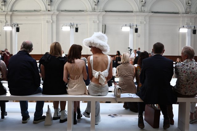 Guests wait for the start of Irish designer Paul Costelloe's catwalk presentation for his Spring/Summer 2024 collection, during London Fashion Week in London, on September 15, 2023. (Photo by Henry Nicholls/AFP Photo)
