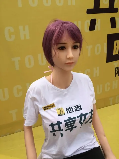 This handout picture taken on September 14, 2017 released by Touch shows A rentable s*x doll on display on a promotional event in Beijing. China already has shared bikes, umbrellas, and basketballs, but one company is taking the country' s embrace of the “sharing economy” to a new extreme with a line of rentable s*x dolls. The Chinese character on the T- shirtS read “sharing girlfriend”. (Photo by AFP Photo/Touch/HO)