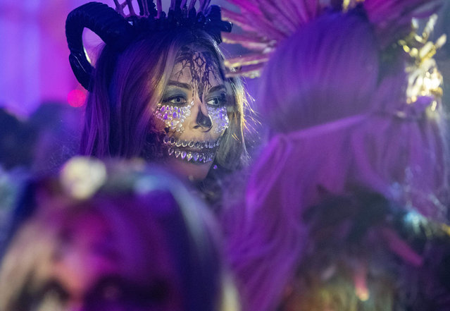Costumed revelers enjoy the Witches' Ball ahead of Halloween in Salem, Massachusetts, on October 27, 2023. (Photo by Joseph Prezioso/AFP Photo)